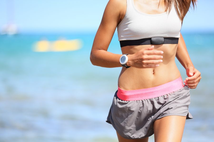 Woman Running With Heart Rate Monitor