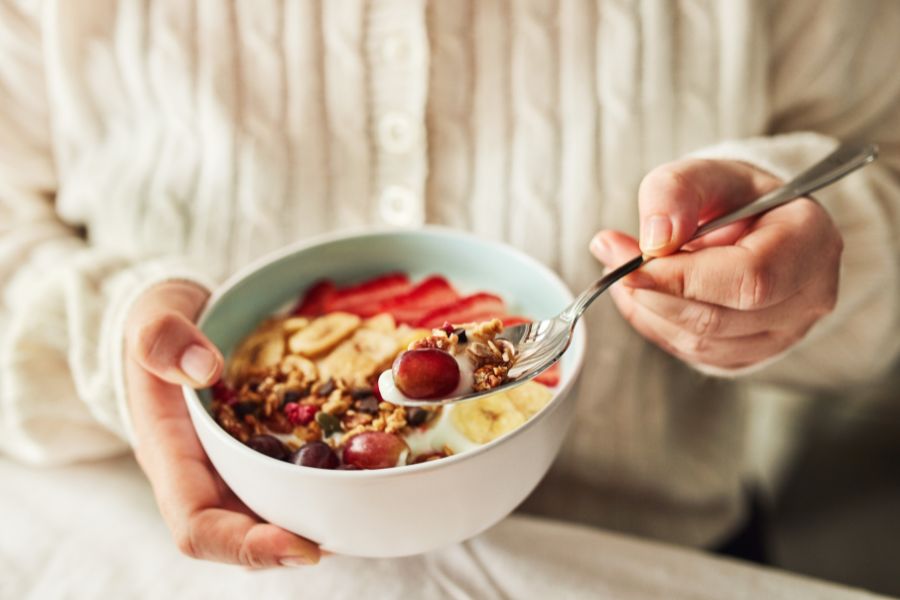 Eating a healthy breakfast in a bowl