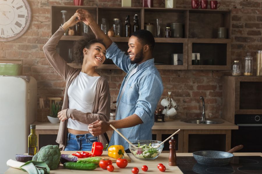 couple dancing in the kitchen